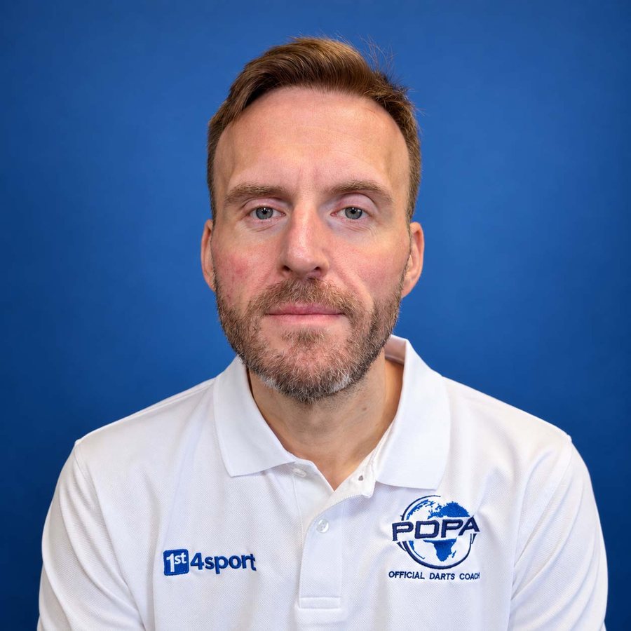 Mark Adams wearing his PDPA Official Darts Coach shirt